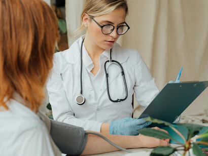 A female doctor tending to her patient