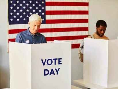 Both a white man and an African-American are voting in the elections hoping their candidates win