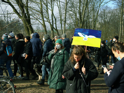 The protest against Vladimir Putin highlights the widespread discontent with the current state of global affairs and the urgent need for effective solutions to ongoing crises