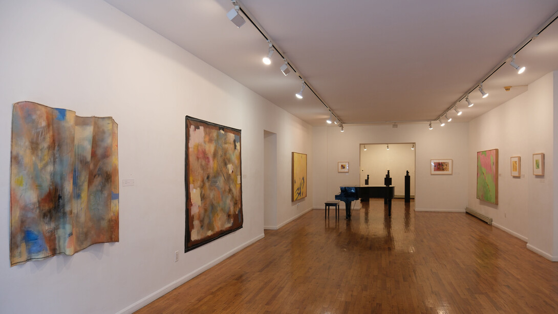 Ashley Cole (left to right) Bellows, From Accordion Folds, Mixed Media, 2023; Round Midnight, Mixed Media, 2023, Cynthia Hawkins; Untitled 1989; Untitled #1,Monotype (Right Wall), Cynthia Hawkins; Untitled 1997,Watercolor, Cynthia Hawkins; Untitled, 1988 Acrylic on Canvas; Yellow Acorn, 2002, Casein and Ink