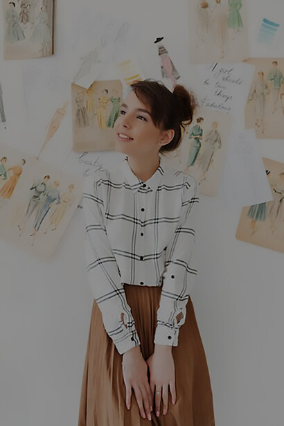 Creative vision with a captivating photo of a fashionable young woman designer clutching her sketchbook, embodying creativity and originality in her designs