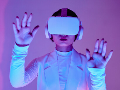 A woman in white controlling VR programs