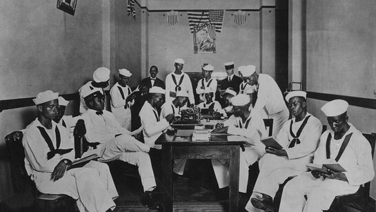 American Red Cross rest room for African American soldiers and sailors, most seen reading, ca. 1919