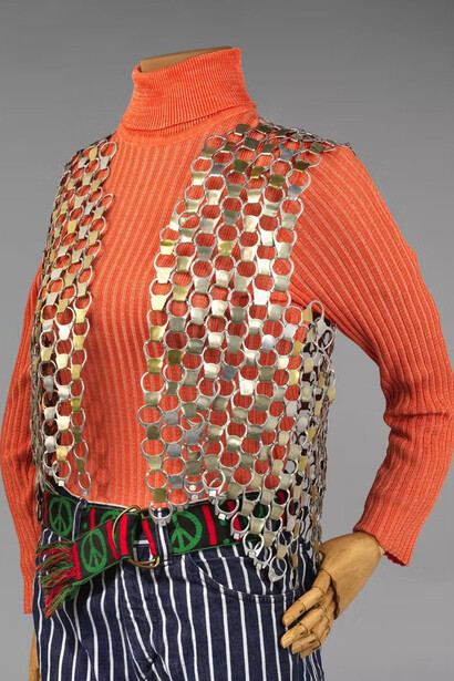 Pull-tab vest, 1970-1975; turtleneck 1970-1975; stripped bell-bottom jeans 1970-1975; woven peace-symbol belt, 1970-1975. Courtesy of the New-York Historical Society Gallery. Photo by Anna-Marie Kellen for the Smith College Historic Clothing Collection