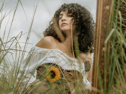 A woman gazing at herself in the mirror, reflecting