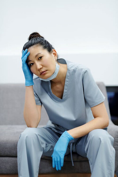 An exhausted nurse finding a moment of respite in a chair