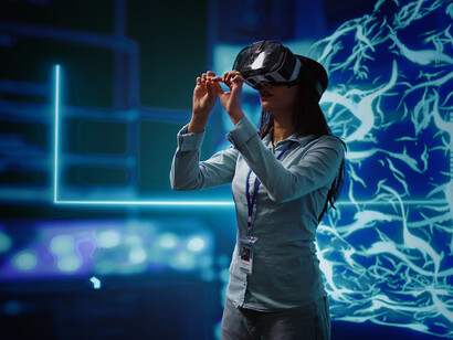 A technician leverages virtual reality technology to develop advanced AI algorithms