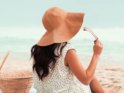 Sitting by the shore, this serene moment highlights the importance of taking time off to rejuvenate the mind and spirit