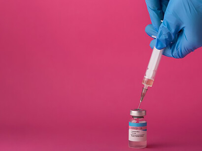 COVID-19 vaccine assortment against pink backdrop highlights the significance of preventive medicine and vaccination