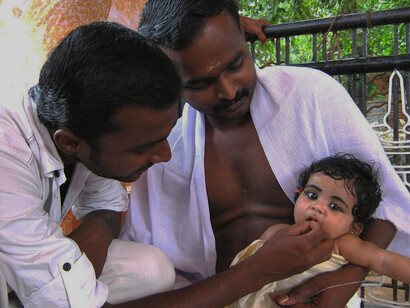 Annaprashanam is the rite of passage where the baby is fed solid food for the first time. The ritual has regional names, such as Choroonu in Kerala, India