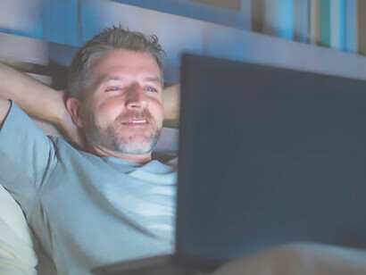 A man with addiction watching adult content