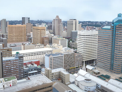 Dynamic skyline of Durban, KwaZulu-Natal, South Africa, adorned with high-rise buildings, showcasing urbanization in the region
