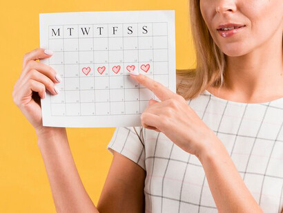 Illustrated menstrual calendar featuring heart shapes, symbolizing women's health and well-being