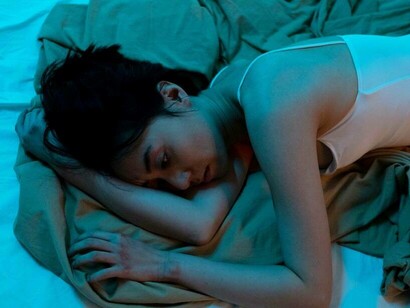 A woman looking solemn and in the middle of a depression