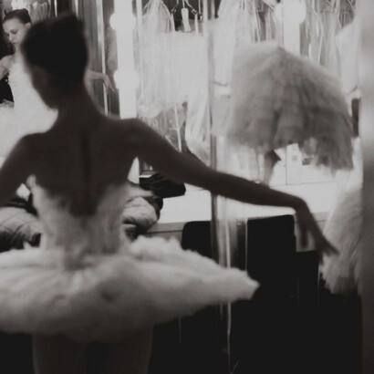 A ballet dancer in a delicate white dress