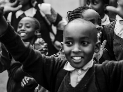 With their backpacks packed and smiles wide, these children are ready to conquer the day and chase their dreams