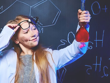 A joyful young scientist enthusiastically engages in a captivating experiment, radiating happiness and curiosity in the pursuit of knowledge