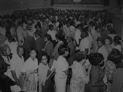 Both men and women African-Americans queuing to vote in the latest elections in 1968
