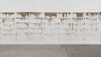 Delocazione 2024, smoke and soot on board 150 x 600 cms. The architecture of knowledge rendered in absence. Claudio Parmiggiani's "Delocazione" is a profound exploration of space, memory, and the silent narratives held within empty forms. Image courtesy of the Artist/Estorick Collection of Modern Italian Art