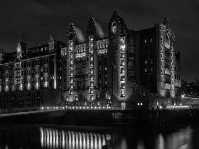 The stunning architecture lining the Nikolaifleet, the canals in Hamburg, Germany, reflects the city's rich history and vibrant multicultural spirit, embodying the essence of urban life