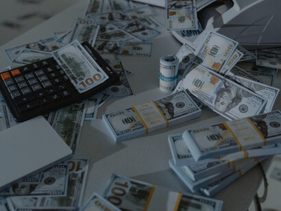 Stacks and stacks of money are being counted
