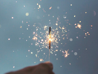 Capturing the magic, person holding lighted sparklers