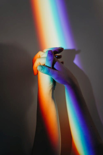 Multicolored hands of diverse individuals
