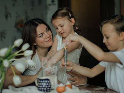 Capturing the essence of maternal multitasking, this photo illustrates how motherhood transforms into a managerial role, blending nurturing instincts with professional prowess