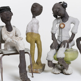 (from left) Horn Player: Louis Armstrong Series, c. 1985–c. 1999; concrete, paint, and mixed media; 32 3/4 x 9 1/2 x 13 1/2 in. Rosa Parks, c. 1985–c. 1999; concrete, paint, and mixed media; 40 x 18 3/4 x 29 in. untitled, c. 1985–c. 1999; concrete, paint, and mixed media; 44 1/2 x 9 1/2 x 12 in. Issues, c. 1985–c. 1999; concrete, paint, and mixed media; 46 x 18 x 25 in. Woman with Fancy Earrings, c. 1985–c. 1999; concrete, paint, and mixed media; 36 x 18 x 10 in. John Michael Kohler Arts Center Collection, gift of Kohler Foundation Inc.
Photo courtesy of John Michael Kohler Arts Center