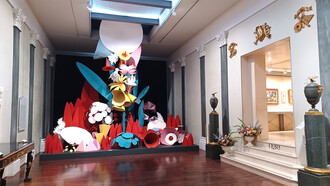 Fortunato Depero (1892–1960) Flora Magica, Stage set reproduction (orig. 1917), 500cm x 500cm x 400cm. Painted paper, cardboard, metal, and wood. Depero designed Flora Magica in 1917 as the scenography for Igor Stravinsky’s ballet Le Chant du Rossignol (The Nightingale). A key figure in Italian Futurism, he co-wrote Futurist Reconstruction of the Universe (1915) with Giacomo Balla, embracing the movement’s dynamic vision