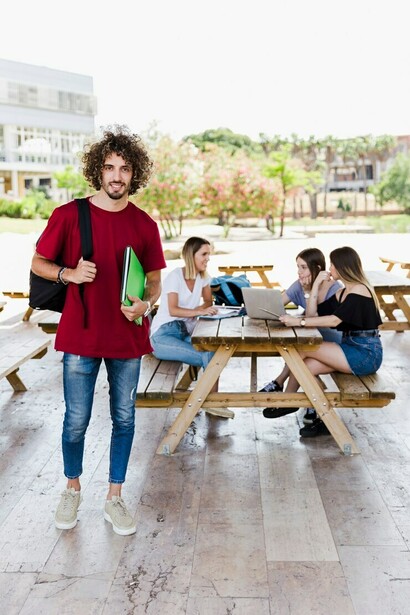 International students studying together at a table, embracing study abroad, cultural exchange, and travel adventure while exploring new cultures