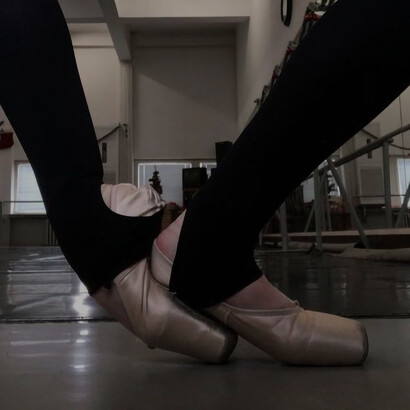 A ballet dancer's foot, twisted nearly halfway