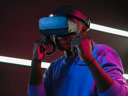Engrossed in a virtual world, a man enjoys gaming through a VR headset
