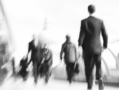 Amid the blur of city life, individuals stride forward, embodying humanity's relentless pursuit of power, success, and the elusive quest for happiness