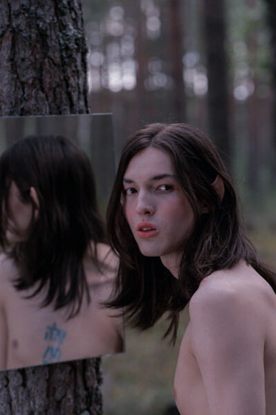 In the mirror's gaze lies a story of desires that transcend physical appearance, reflecting the journey to embrace authenticity