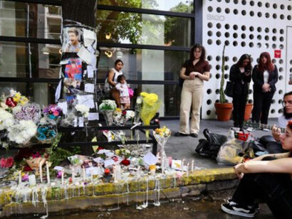 A group of fans gathered in front of the Casa Sur Hotel in Buenos Aires' Palermo neighborhood, where Liam Payne passed away, leaving floral tributes and photos in his memory