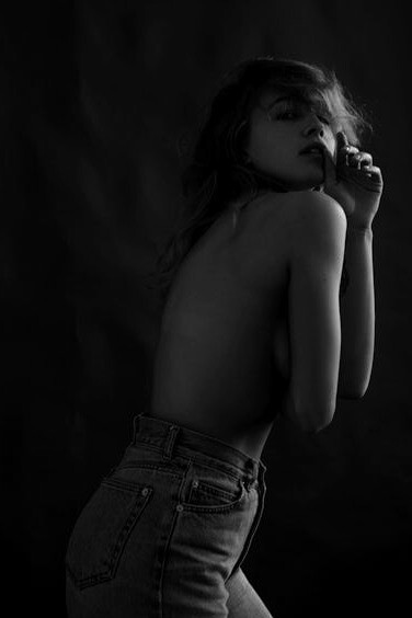 Posing with a sense of liberation, she represents the journey of exploring pleasure that starts within and transcends societal boundaries