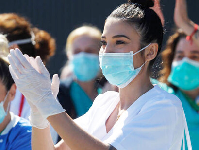 A united group of healthcare workers protesting, demanding systemic change in medical rights and access, Spain