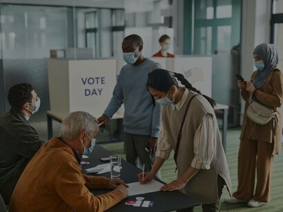 Potential voters registering before heading into the booths to vote