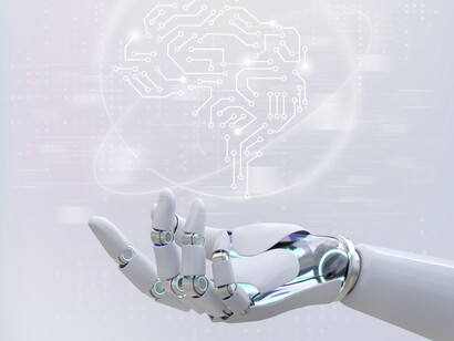 A robotic hand holds a holographic image of a microchip