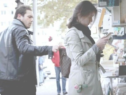 A pickpocketer ready to snatch an unsuspecting person's wallet in Paris, France