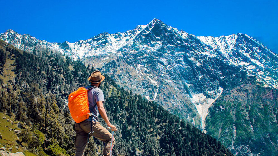 Gazing at the majestic mountain peaks, the traveler contemplates the awe-inspiring beauty of nature, ready to embark on an adventure that goes beyond mere sightseeing to embrace the ethos of sustainable travel