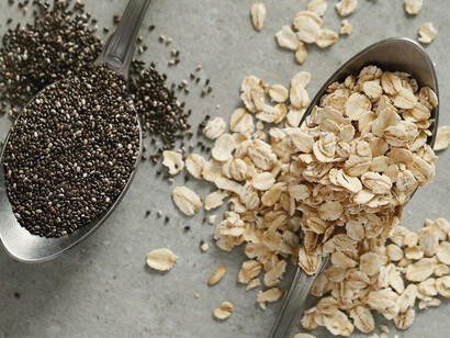Fresh, nutrient-packed seeds on a spoon, perfect for enhancing hormonal balance and menstrual health