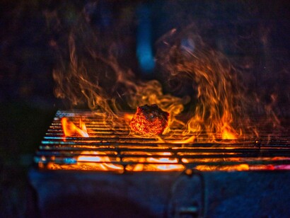 Barbequing with charcoal and meat