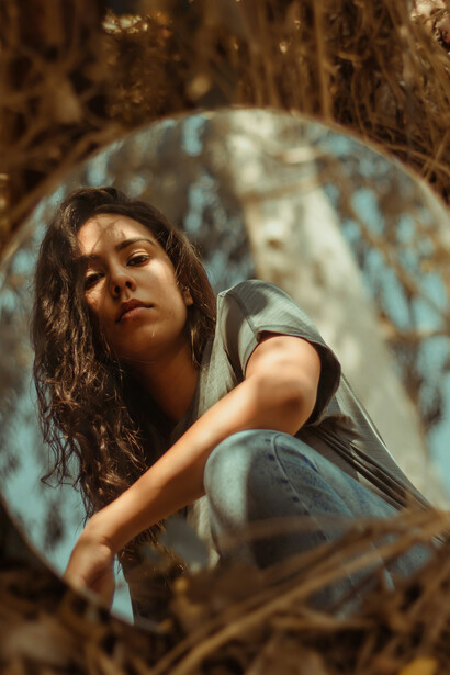 A mirror reflecting the skies clearly in a symbolic depiction of a clear sense of self