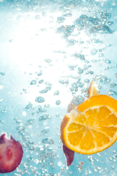 Water infused with fresh citrus fruits; in the journey towards optimal health, understanding the interplay between our genes and gut microbiome is key
