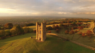 A white castle captured in photography, with Broadway Tower bathed in the soft, fading autumn sunshine late in the day. Broadway Tower & Country Park, Broadway, United Kingdom