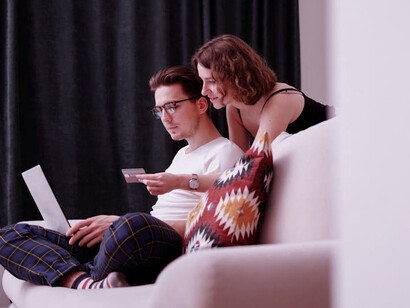 Exploring endless possibilities from the comfort of their living room, this couple is thrilled to see how accessible the world has become through online shopping