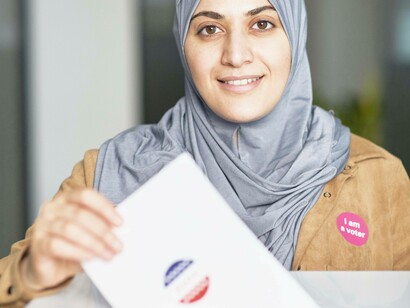 A voter about to submit their ballot and achieving an important milestone at being a better voter