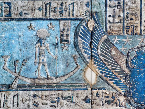 A close up view of the artwork and paintings on the roof of the Dendera Temple of Hathor, an ancient sanctuary dedicated to the goddess Hathor, situated in Dendera, Egypt, showcasing the beauty of the Egyptian blue pigment